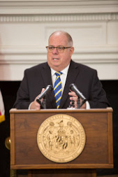 Maryland Governor Larry Hogan speaks at a podium.