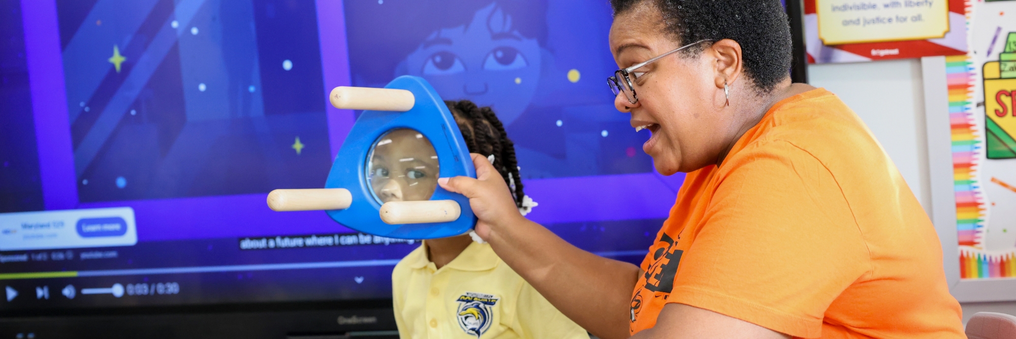 Teacher using glass object in classroom