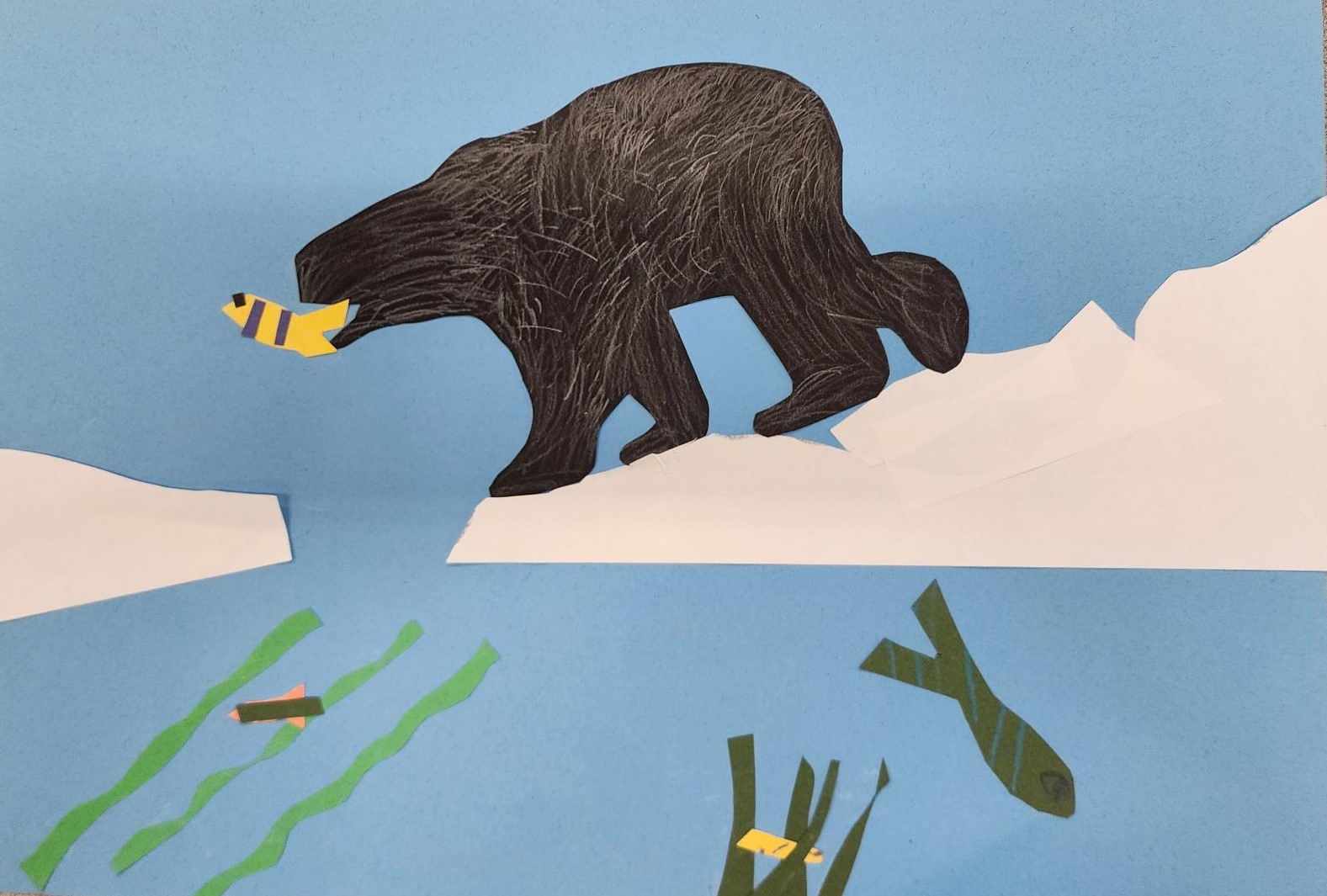 Collage depicting a bear catching a fish in its mouth. Medium: Paper