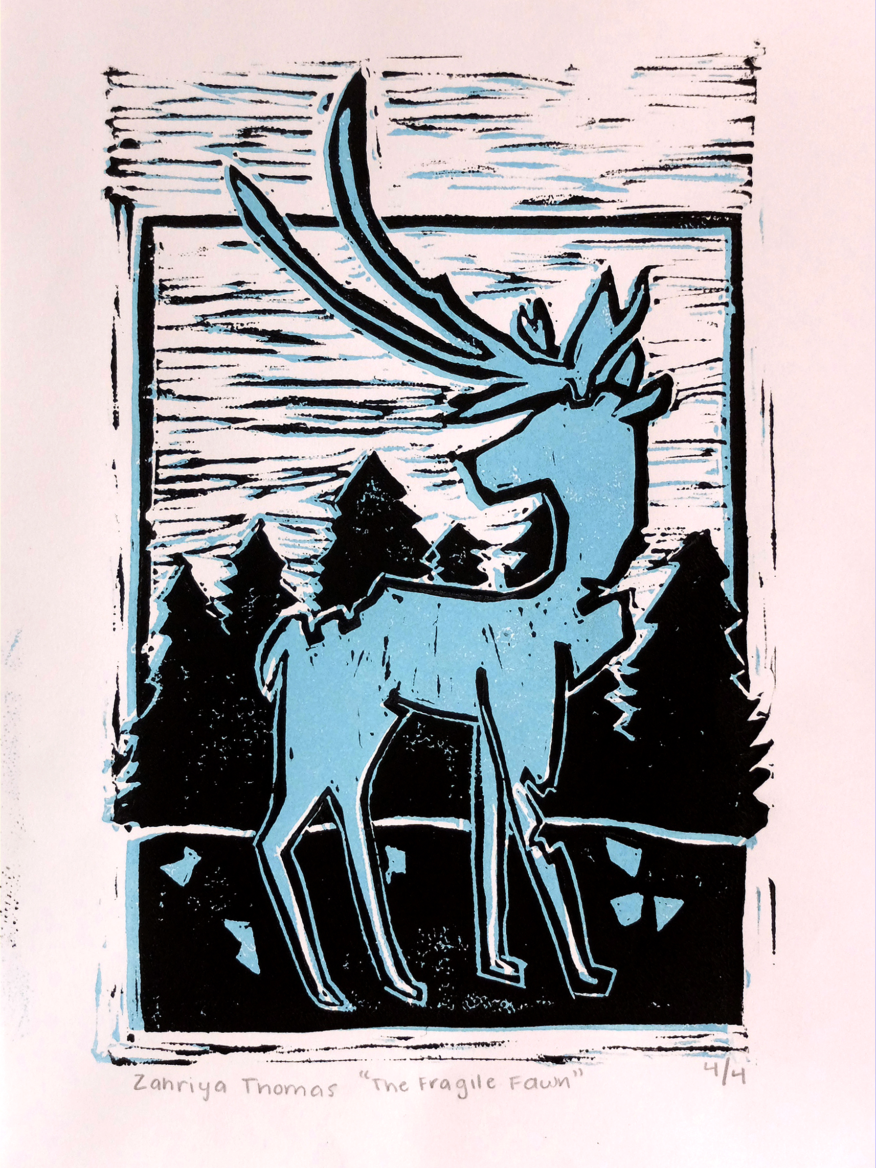 Titled, The Fragile Fawn, a blue moose fawn with antlers in a wooded area with missing pieces of itself lying on the ground around it. Medium: Block print