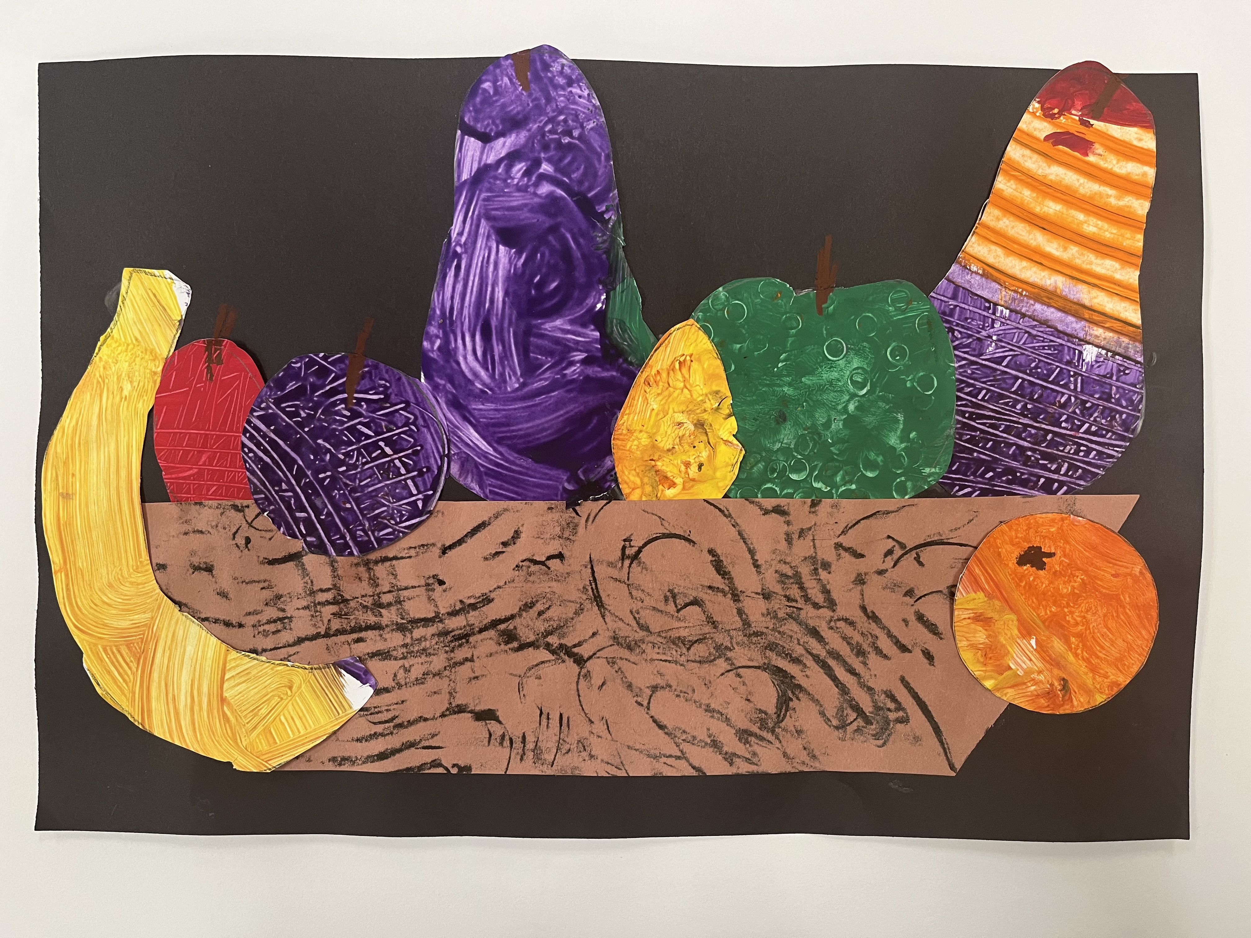 Cut‑out fruit basket with colorful shapes assembled in layers. Mixed media.
