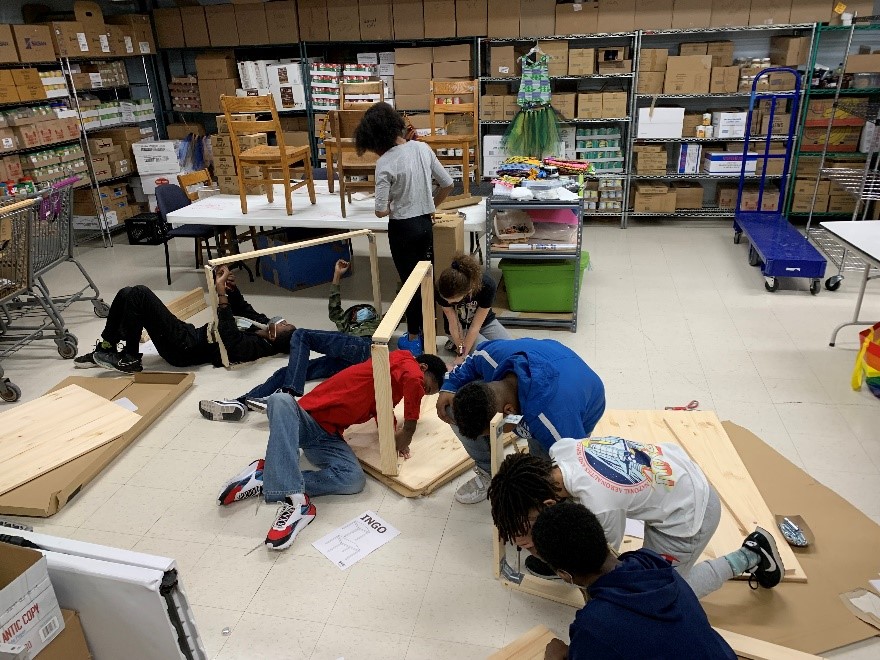 students building tables